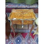 A French kingwood and marquetry dressing table, the shaped hinged top with brass edge on cabriole