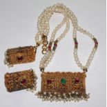 A pearl and stone set necklace and earrings in the style of Indian Mogul jewellery