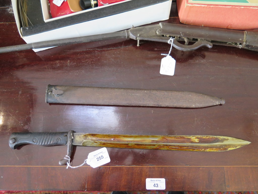 A German bayonet, with metal scabbard, the blade by Frister and Rossman, Berlin, blade 37cm long