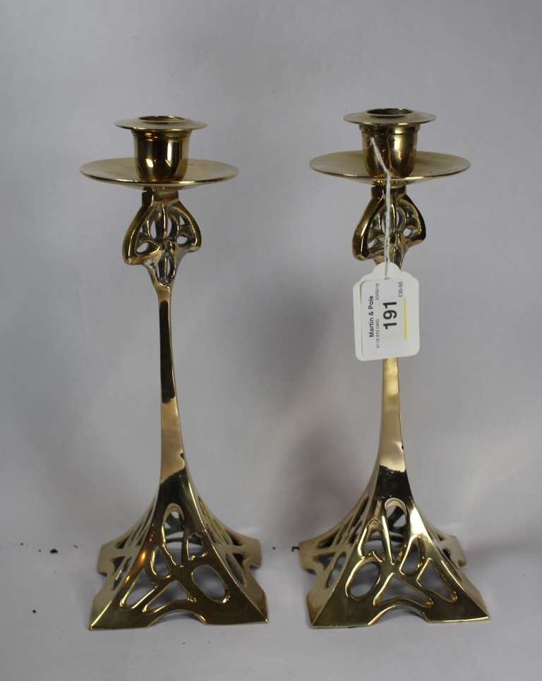 A pair of Art Nouveau style brass candlesticks, 25cm high