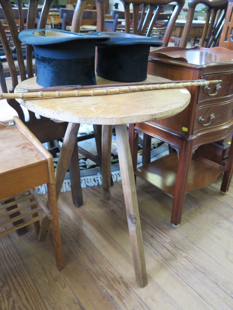 An ash cricket table, the circular top on three chamfered legs 54cm diameter