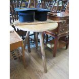 An ash cricket table, the circular top on three chamfered legs 54cm diameter