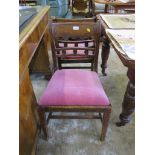 A pair of Regency mahogany dining chairs, the reeded tablet back with roundel mid rails over drop in