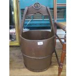 A timber and metal bound yoke bucket 62cm high