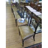 A set of seven late George III mahogany dining chairs, including one carver, the tablet top rails