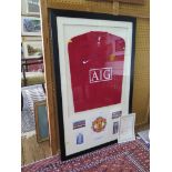 Football Memorabilia: A replica Manchester United shirt with thirteen autographs, framed with photos