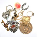 A miscellaneous collection of items to include rings, brooches, etc