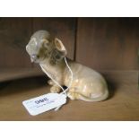 A Royal Copenhagen model of a seated Daschund lopped ear puppy figurine 3140