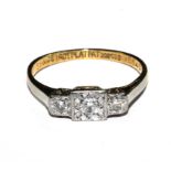 A three stone diamond ring set in 18 carat gold