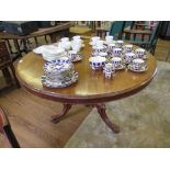 A mid Victorian mahogany snaptop breakfast table, the circular top on a baluster stem with tripod