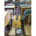 A small Russian guitar and a teaching book