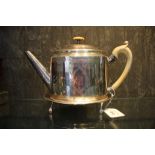 An 18th century silver tea pot and matching tea pot stand, on four feet, both tea pot and stand