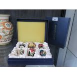 A set of six miniature Moorcroft vases 5.5cm high, all in a single case (6)