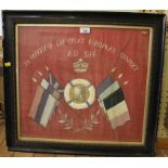 A First World War embroidered memorial panel, with photo of a soldier within European flags, 46cm