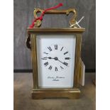 A brass carriage clock time piece, retailed by Charles Frodsham, 15cm high