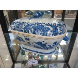 A Chinese 18th century porcelain blue and white oblong tureen and cover with pomegranate finial