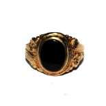 A 9 carat gold signet ring set with black onyx stone