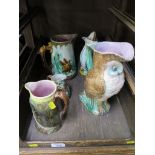 Five Majolica jugs, including one in the form of an owl 25cm high, and another in the form of a fish