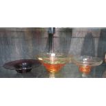 Two Whitefriars amber glass bowls, 31cm and 25cm diameter, and a purple glass bowl 30cm diameter (