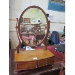 A George III style oval toilet mirror, by Cameo Furniture, with two drawers and ogee bracket feet,