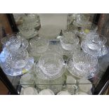 A set of ten cut glass dessert bowls and fourteen matching saucers