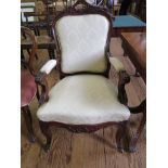 A French 19th century style open armchair, the acanthus carved top rail over an upholstered back,