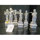 A set of six continental Blanc de Chine cherub orchestra figures, 14cm high
