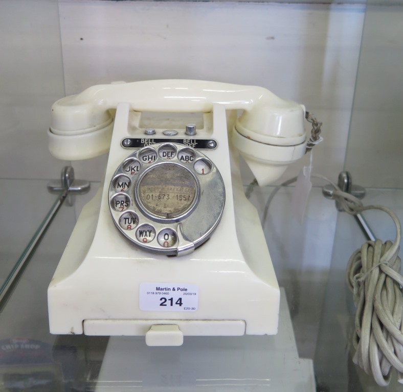 A 1940s cream phenolic telephone with bell on/bell off buttons