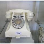 A 1940s cream phenolic telephone with bell on/bell off buttons