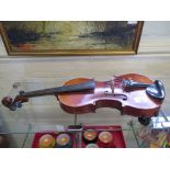 A violin, with two piece back, no label or case, length of back 36.5cm