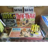 A Tri-ang Trik-Trak Dare Devil racing kit, a Trik-Trak Cross Country Road Rally kit and four