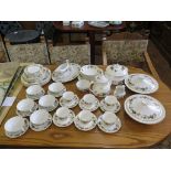 A Royal Doulton Larchmont pattern tea and dinner service, including three tureens, teapot and