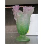 A Daum glass vase, in pink and green depicting flowerheads in a circular vase on a pedestal base,