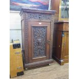 A Victorian carved oak pedestal cabinet, the acanthus carved drawer over a mask carved door 57cm