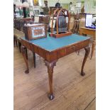 *A George II walnut foldover card table, with concertina action legs, the rectangular top with