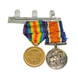 A World War I British War medal to 8481 PTE A. Mardles W.York.R. on the same display bar but to a