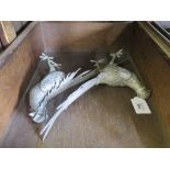 A pair of white metal figures of exotic birds, 35cm and 29cm long (2)