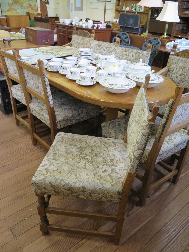 A set of eight oak dining chairs, including two carvers, the upholstered backs and seats on turned