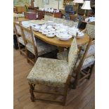 A set of eight oak dining chairs, including two carvers, the upholstered backs and seats on turned