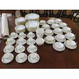 A Minton Adam pattern part dinner service with coffee cups and saucers, 110 pieces