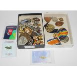 A collection of badges to include a World War I Victory medal and the British War medal awarded to