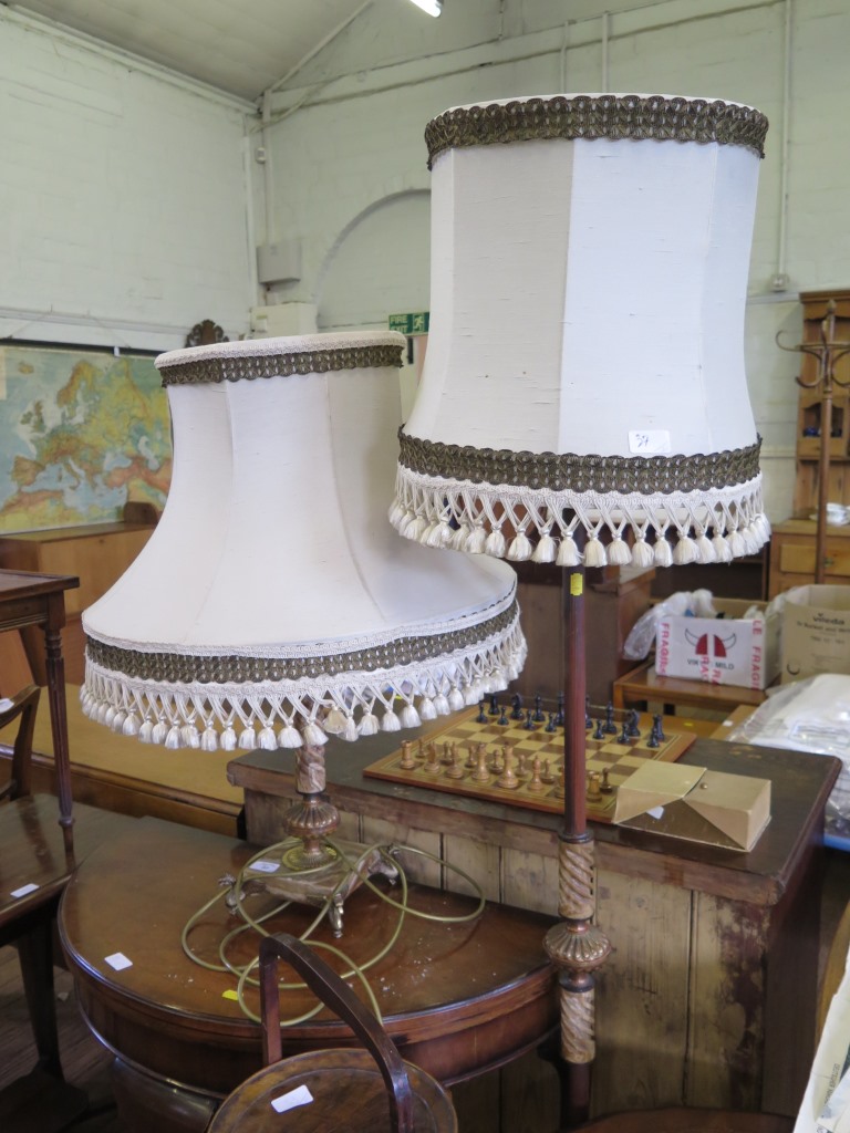 A marble effect table lamp, with spiral support and griffin feet, and a similar standard lamp (2)