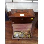 A 19th century mahogany sarcophagus form tea caddy with pad feet 28cm wide, and a set of brass