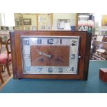 An Art Deco style oak mantel clock, of rectangular form with chrome numerals, the twin train