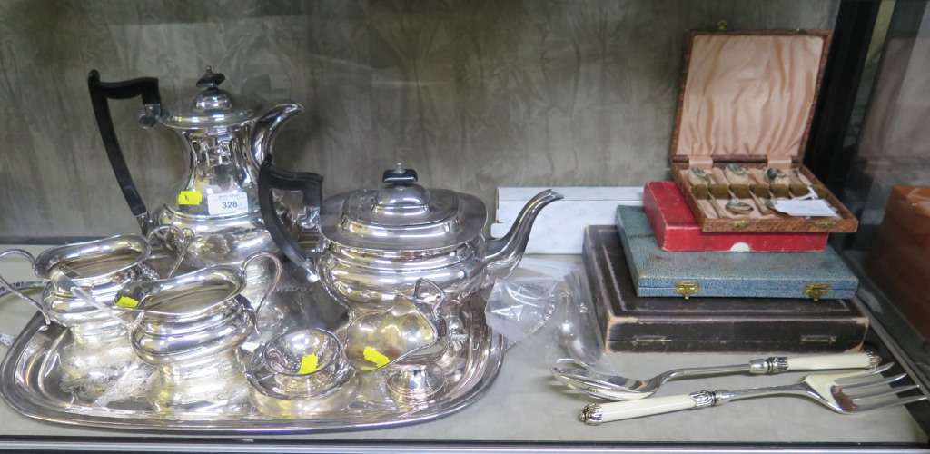 A silver plated tray, a four piece silver plated tea set, etc