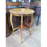 A walnut occasional table, octagonal top with carved wavy rim and small undershelf 55cm diameter,