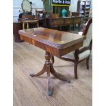 A Regency style mahogany foldover card table, with turned support and four moulded outsplayed legs