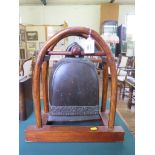 A Thai bronze bell, in a timber frame, total height 44cm