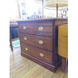 An Edwardian oak chest of drawers, with three long graduated drawers on a plinth base 92cm wide