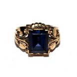 A 9 carat gold ring set with blue stone